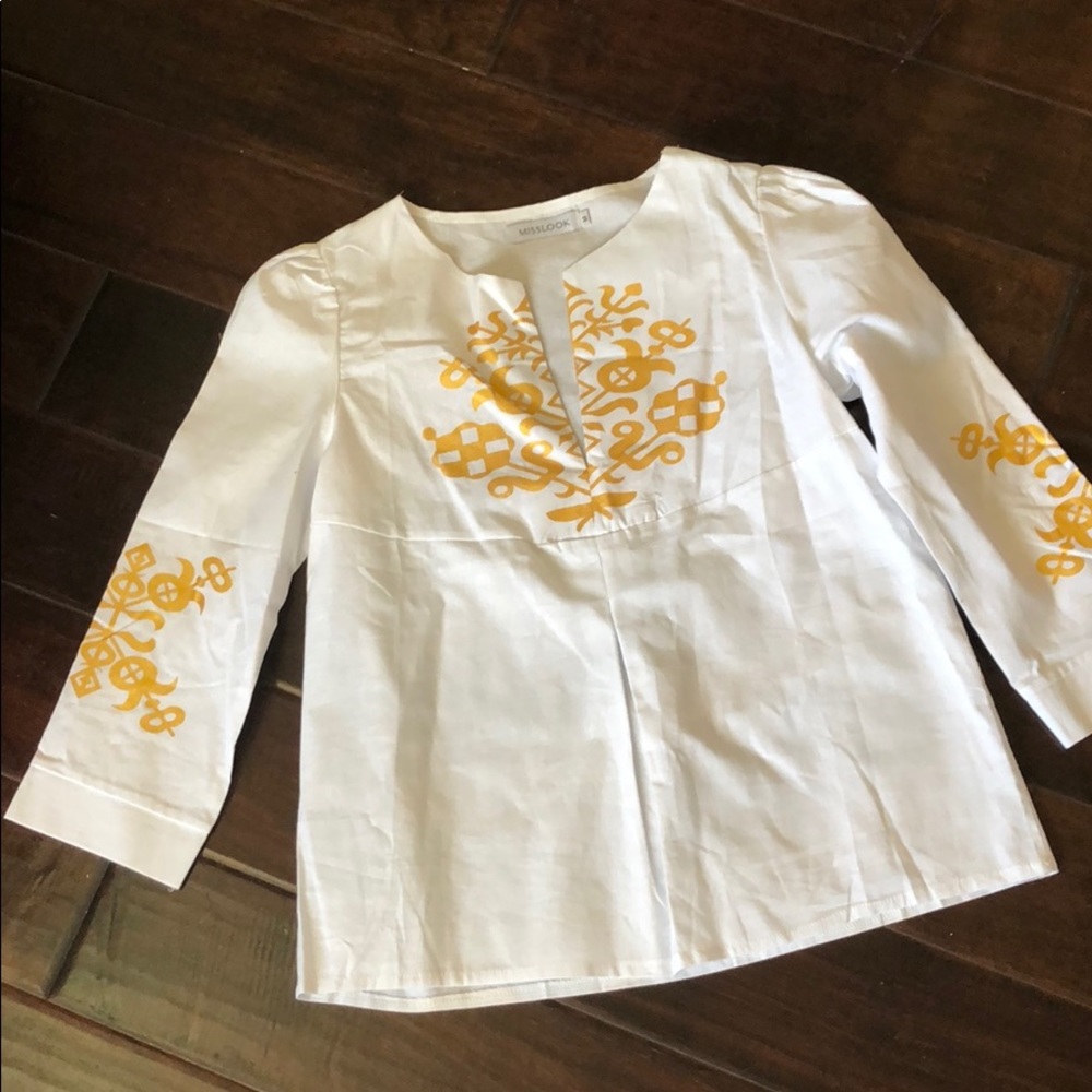 White cotton blouse with gold decoration